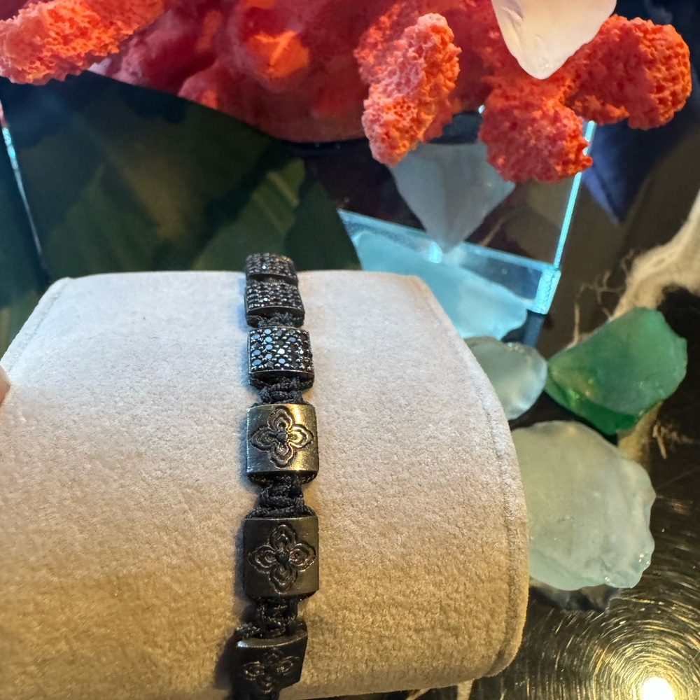 Elegant Black Bracelet with Floral Accents